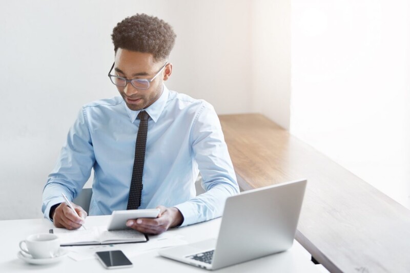 successful-young-male-dark-skinned-accountant-with-afro-hairstyle-and-bristle-using-digital-tabletc4a2e33ae3c33cc8.jpg